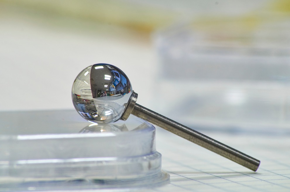 A ball lens retroreflector glued onto a metal stick.